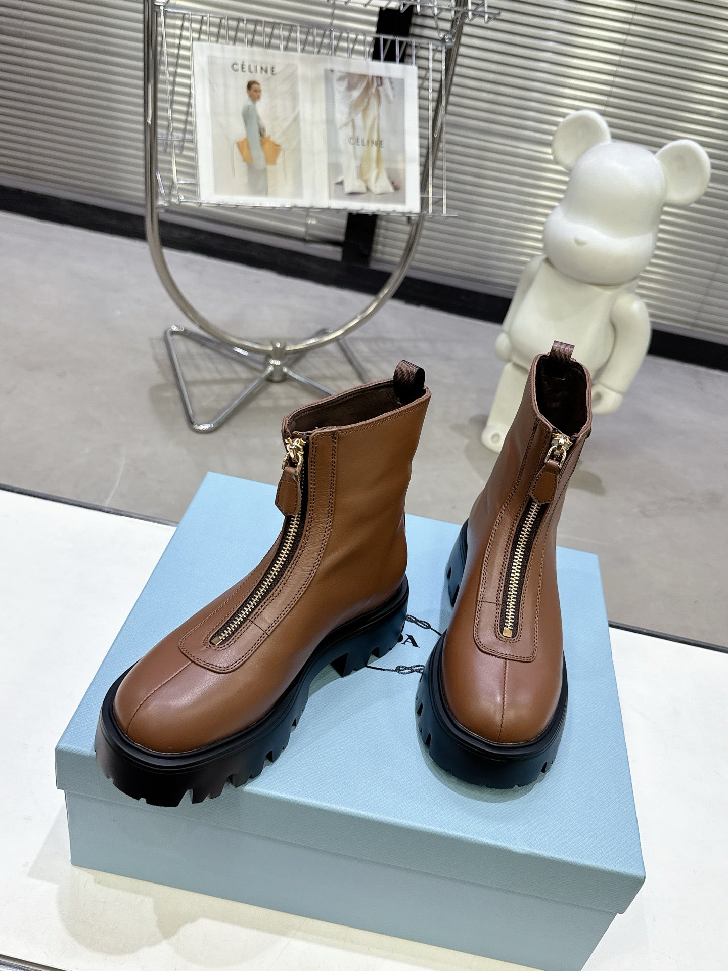 PRADA 25S ZIP-UP ANKLE BOOTS IN BROWN CALFSKIN