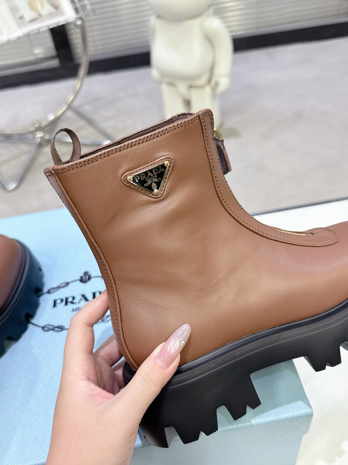 PRADA 25S ZIP-UP ANKLE BOOTS IN BROWN CALFSKIN