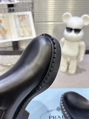 PRADA 25S RETRO PLATFORM MARTIN BOOTS IN BLACK CALFSKIN