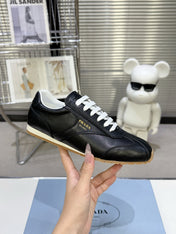 PRADA 26S LACE UP SNEAKERS IN BLACK CALFSKIN