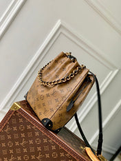 NOÉ TRUNK 23 IN BROWN MONOGRAM REVERSE CANVAS GOLD HARDWARE