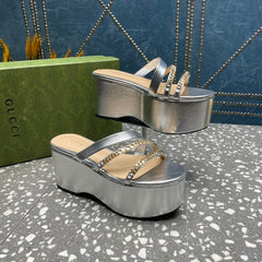 HIGH WEDGE PLATFORM IN SILVER CALFSKIN WITH GOLD HARDWARE