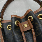 CLARA BAG 19 IN BLACK TRIOMPHE CANVAS AND BROWN CALFSKIN TRIM