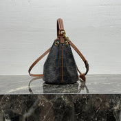 CLARA BAG 19 IN BLACK TRIOMPHE CANVAS AND BROWN CALFSKIN TRIM