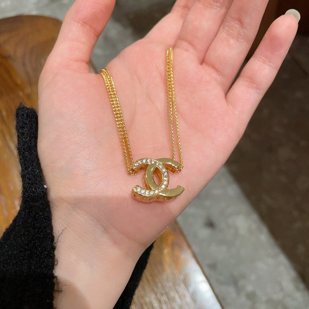 DOUBLE C HEART NECKLACE IN GOLD METAL