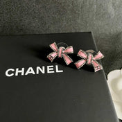 CHANEL 26S PINK ENAMEL BOW CRYSTAL STUD EARRINGS IN BLACK METAL 629977