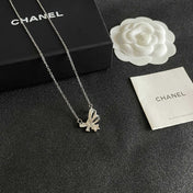 CHANEL 26S DOUBLE C LOGO CRYSTAL BOW & STAR PENDANT NECKLACE IN SILVER METAL 631019