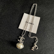 CHANEL 26S DOUBLE C LOGO PEARL DROP PENDANT NECKLACE WITH CRYSTAL HALO IN SILVER METAL 633293