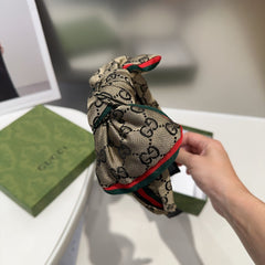 BOW HAIRBAND IN DARK BEIGE MONOGRAM CANVAS 414472