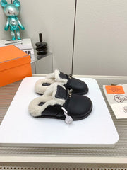 SLIP-ON MULE IN BLACK CALFSKIN AND SHEARLING LINING