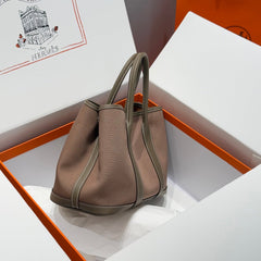 GARDEN PARTY 30CM IN BROWN TOILETS COTTON CANVAS AND TOGO ETOUPE CALFSKIN