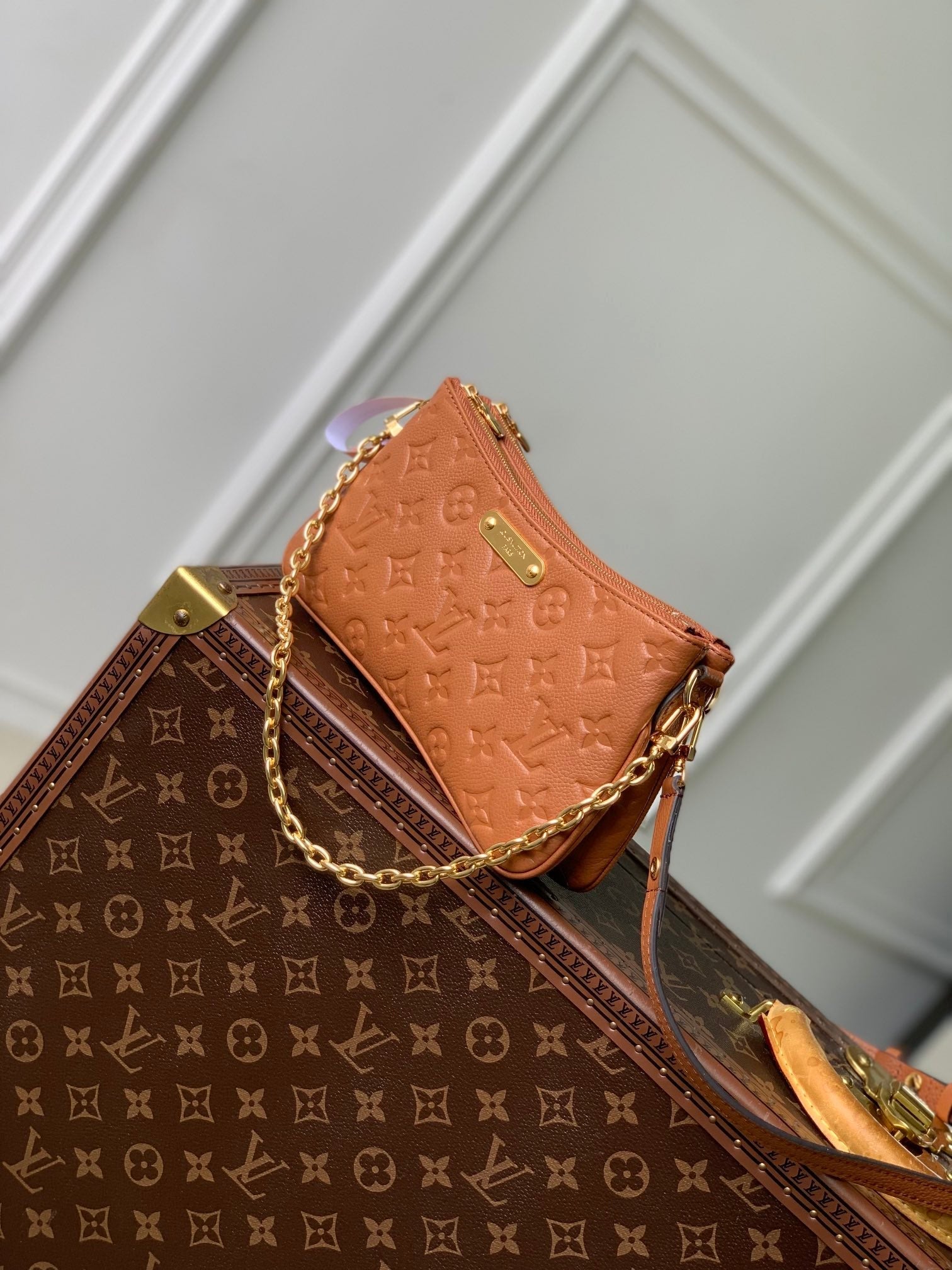 LIV POCHETTE BAG 24 IN COGNAC BROWN MONOGRAM EMPREINTE LEATHER