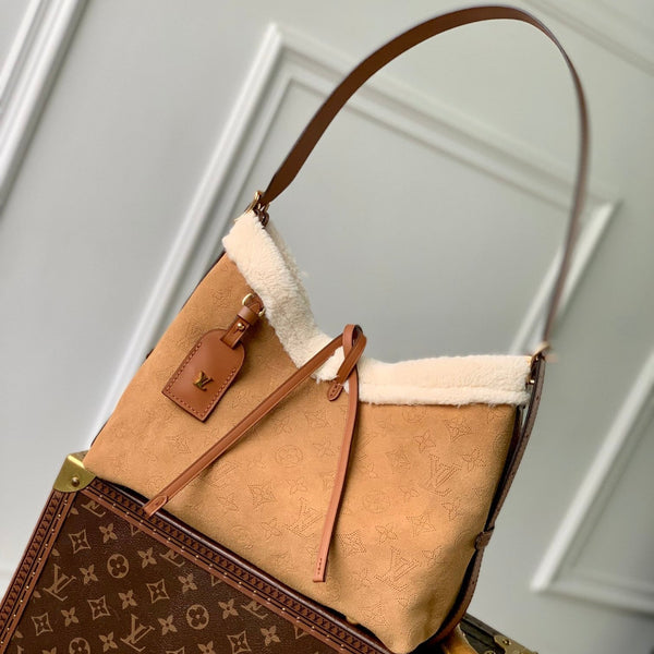 CARRYALL PM 29 IN CIDER BROWN MONOGRAM PERFORATED SUEDE AND WHITE SHEARLING TRIM