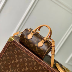NANO SPEEDY DATING 18 IN BROWN COATED CANVAS GOLD HARDWARE