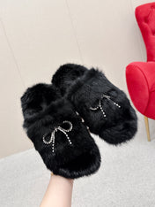 BALENCIAGA 25S SOFT FUR SLIPPERS IN BLACK FUR WITH RHINESTONE BOW