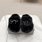 BALENCIAGA 25S SOFT FUR SLIPPERS IN BLACK FUR WITH RHINESTONE BOW