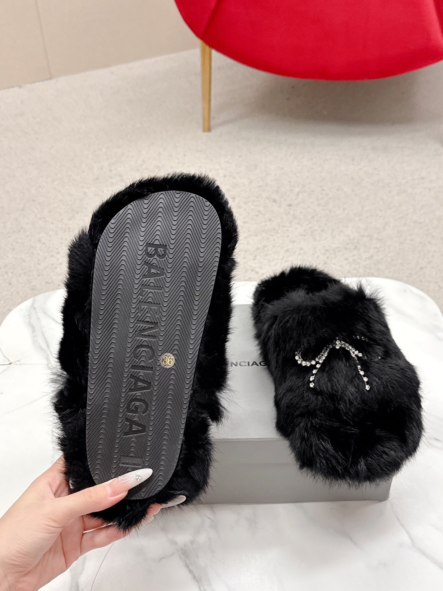 BALENCIAGA 25S SOFT FUR SLIPPERS IN BLACK FUR WITH RHINESTONE BOW