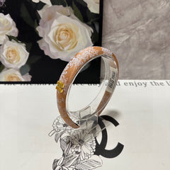 HEADBAND WITH GARNITURE PRINT IN TIGER EYE ORANGE SILK 432822