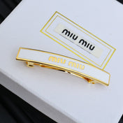 MIUMIU 26S LOGO BAR HAIR CLIP IN WHITE ENAMEL AND GOLD TONE METAL 612610