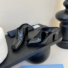 HIGH HEEL MULES WITH GOLD LETTERING LOGO IN BLACK GLOSSY CALFSKIN