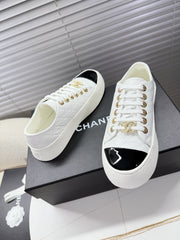CHANEL 25S TRAINERS WHITE AND BLACK 35MM IN CALFSKIN
