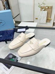 TRIANGLE LOGO MULES IN WHITE CALFSKIN