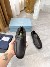 PRADA 25S LOAFERS IN BLACK CALFSKIN