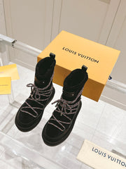 ASPEN PLATFORM ANKLE BOOT IN BLACK MONOGRAM DEBOSSED SUEDE AND SHEARLING