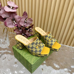 HORSEBIT SLIDE SANDAL IN TUSCANY YELLOW MONOGRAM CANVAS AND SHEEPSKIN LINING