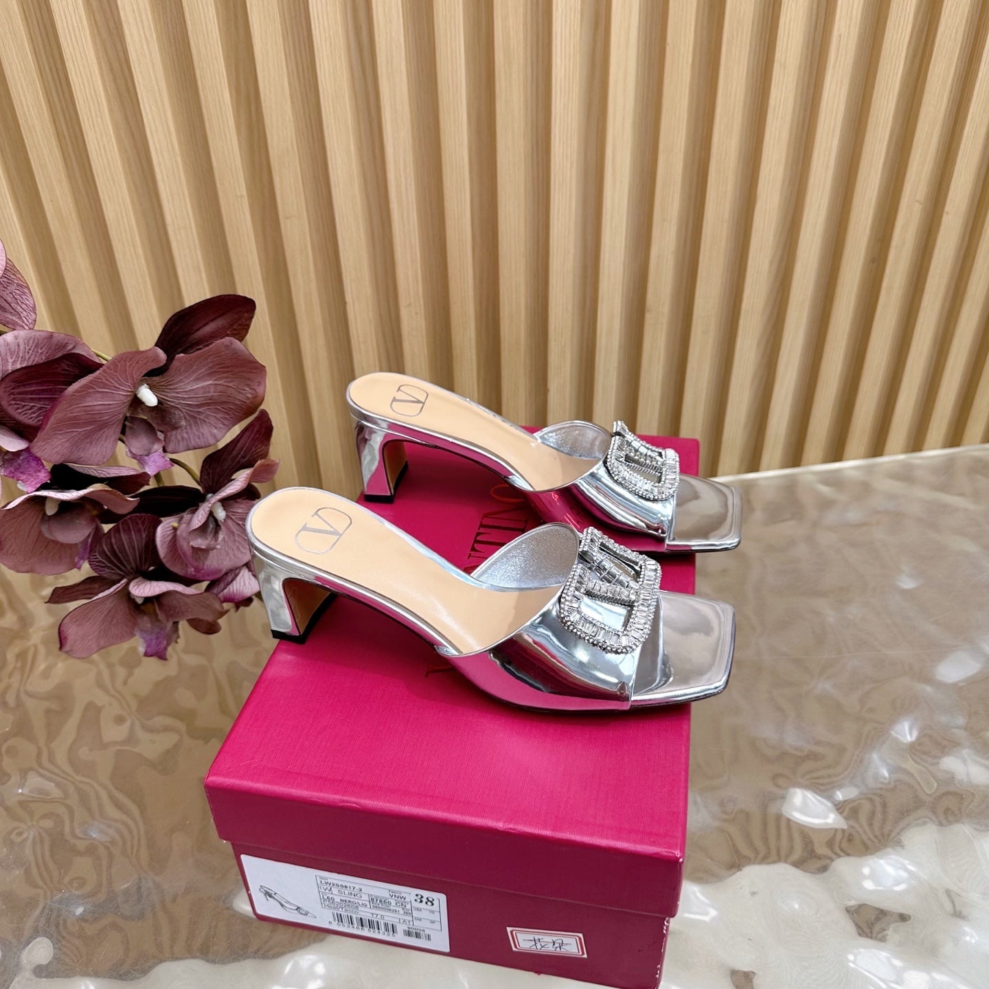 VALENTINO 25S HIGH-HEEL MULES 60 MM IN SILVER PATENT CALFSKIN WITH CRYSTAL-EMBELLISHED STRAP