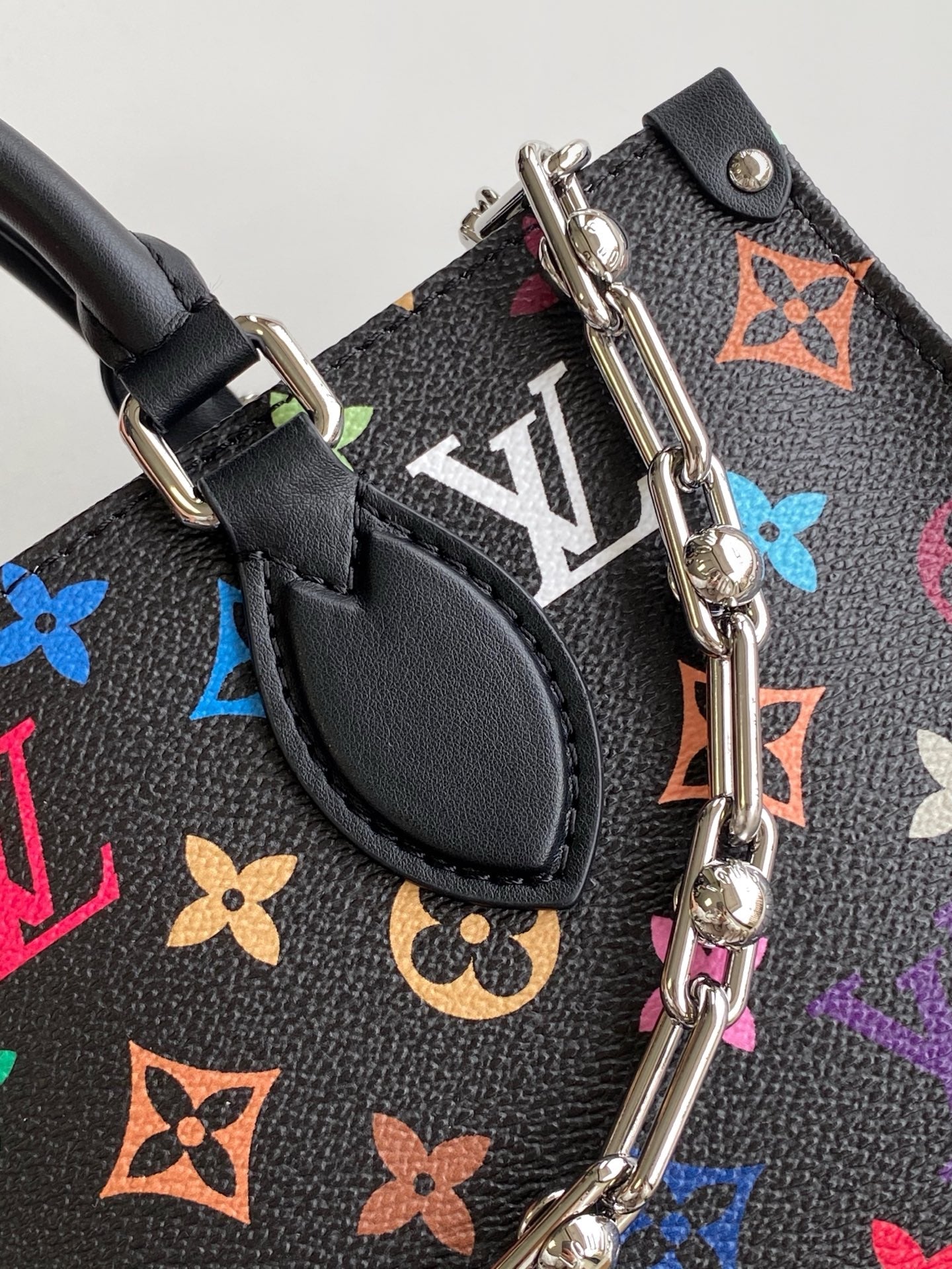 ONTHEGO EAST WEST BAG 25 IN COLORFUL MONOGRAM PATTERN CANVAS