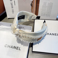 WHITE FABRIC WITH GOLD LOGO HAIRBAND 410841