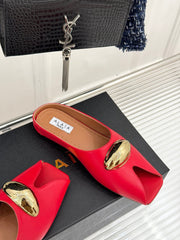 ALAIA FLAT MULE IN CRIMSON RED LAMBSKIN WITH GOLD HARDWARE