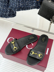 SLIDE SANDALS IN BLACK CALFSKIN WITH GOLD HARDWARE