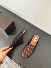 ALAIA FLAT MULES IN BLACK MESH FISHNET