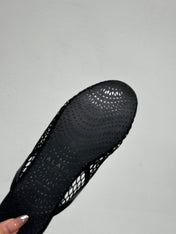 ALAIA FLAT MULES IN BLACK MESH FISHNET