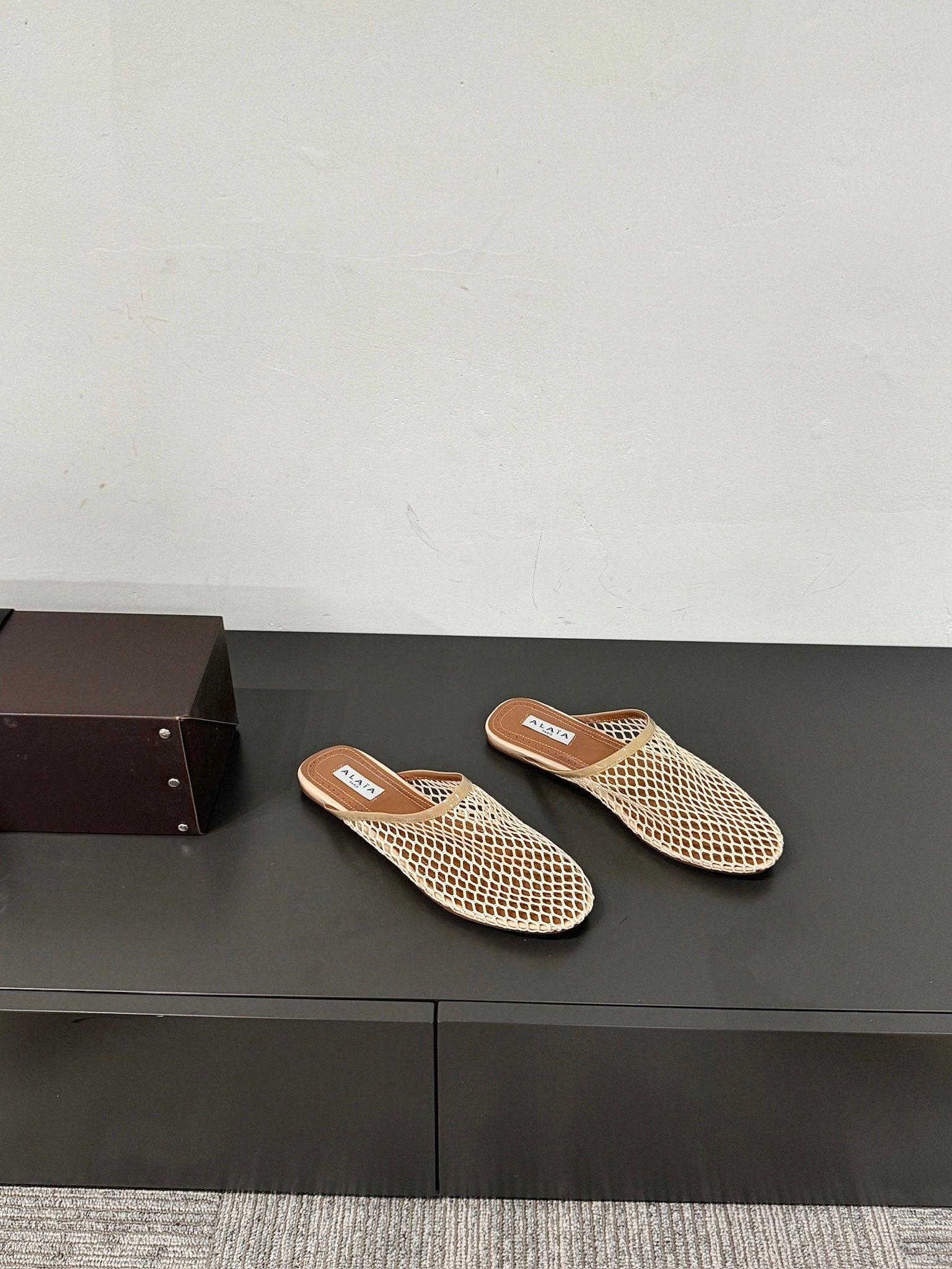 ALAIA FLAT MULES IN BEIGE MESH FISHNET