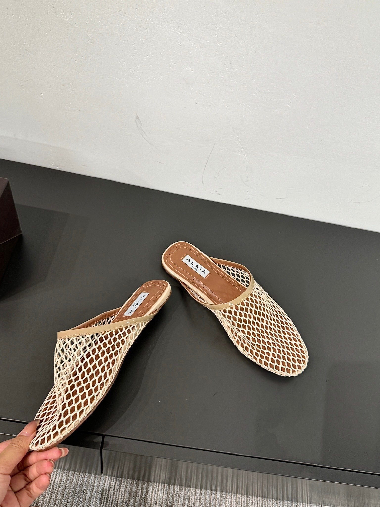 ALAIA FLAT MULES IN BEIGE MESH FISHNET