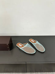 ALAIA FLAT MULES IN LIGHT BLUE MESH FISHNET