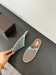 ALAIA FLAT MULES IN LIGHT BLUE MESH FISHNET