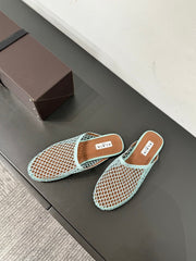 ALAIA FLAT MULES IN LIGHT BLUE MESH FISHNET