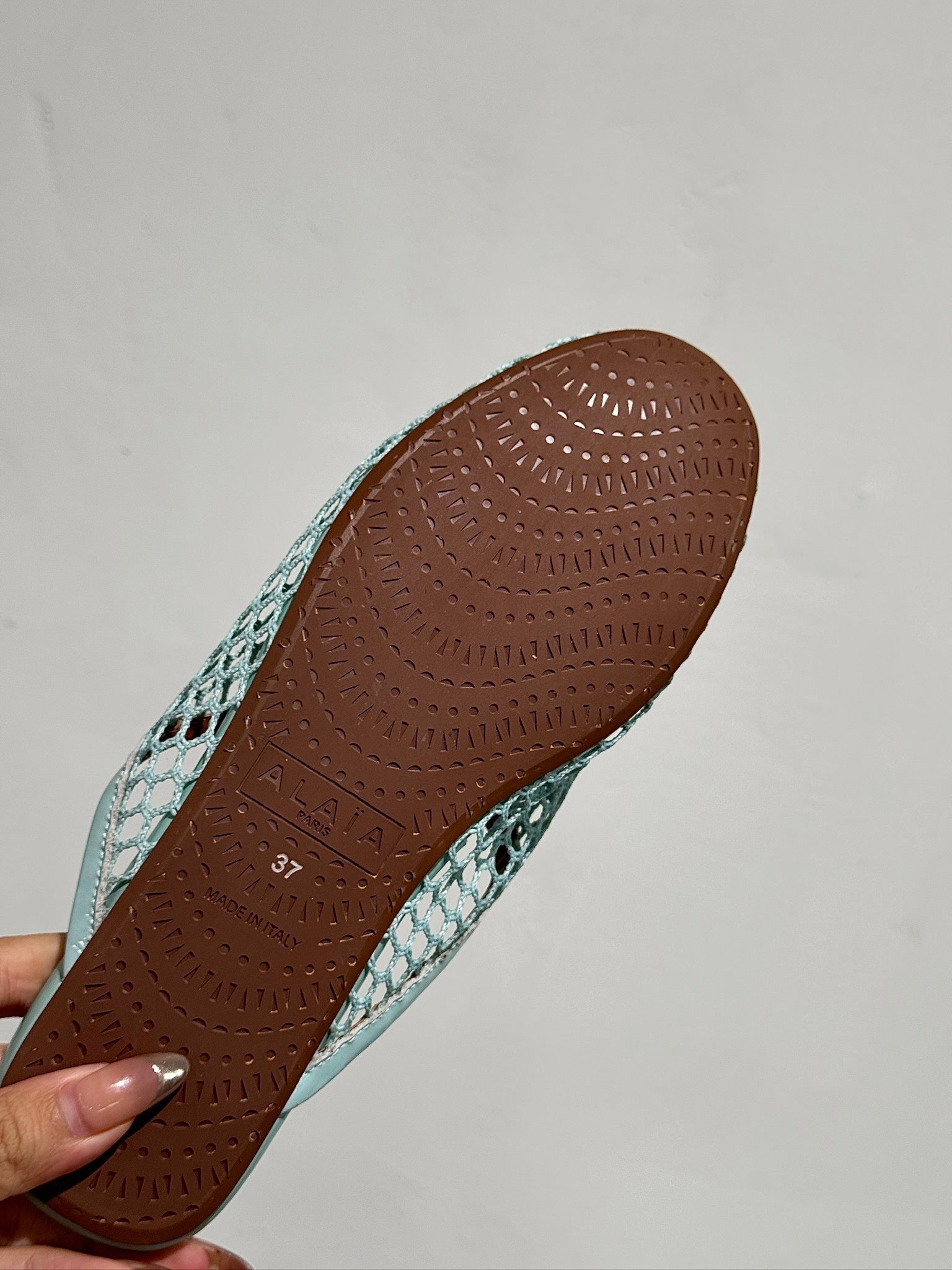 ALAIA FLAT MULES IN LIGHT BLUE MESH FISHNET