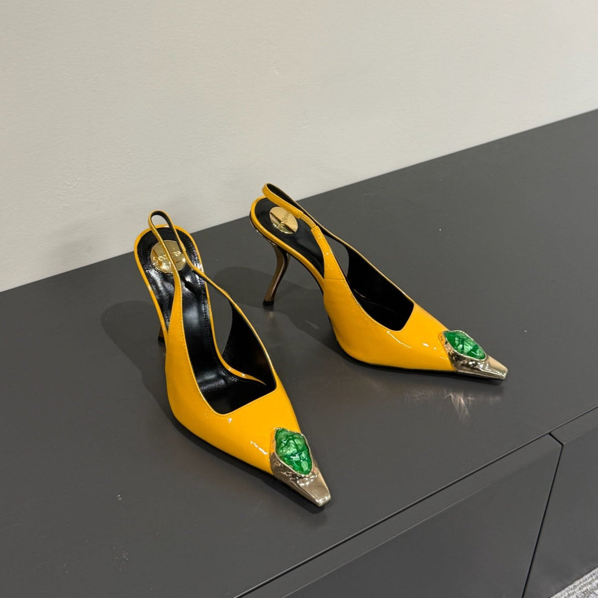 GREEN GEM-STUDDED SLINGBACK PUMPS IN YELLOW PATENT CALFSKIN
