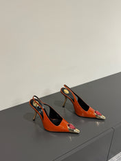 RED GEM-STUDDED SLINGBACK PUMPS IN ORANGE PATENT CALFSKIN