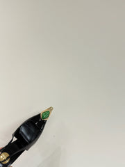 GREEN GEM-STUDDED SLINGBACK PUMPS IN BLACK PATENT CALFSKIN