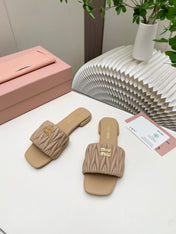 MIUMIU 26S MATELASSE SLIDES IN BEIGE CALFSKIN