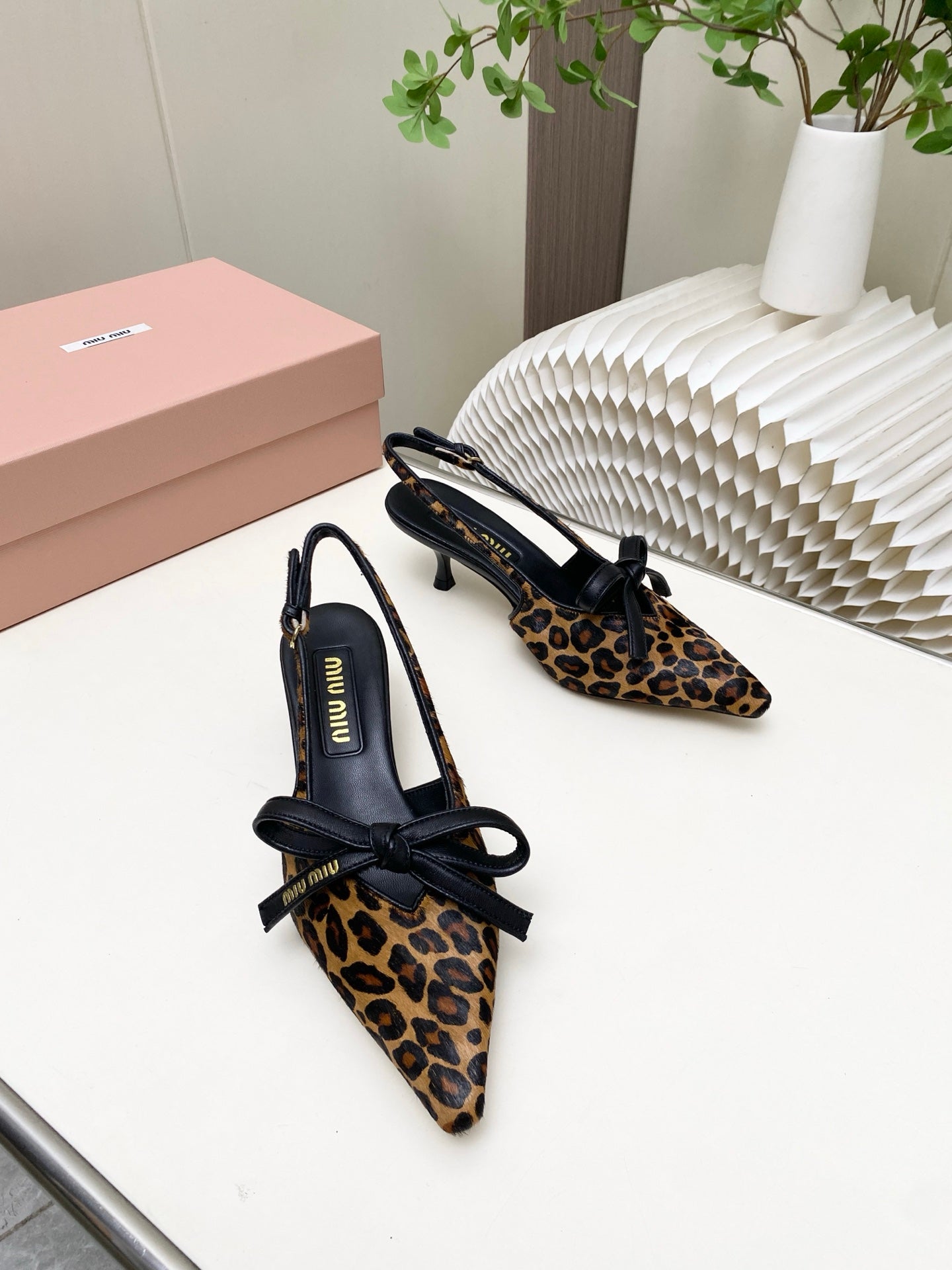 MIUMIU 26S SLINGBACK PUMPS 55MM IN LEOPARD PRINT CALF HAIR WITH BOW