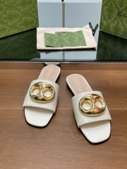 FLAT MULE IN WHITE CALFSKIN WITH GOLD HARDWARE