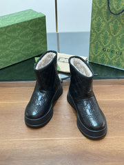 GG UGG BOOTS IN BLACK EMBOSSED DEERSKIN AND BEIGE WOOL LINING