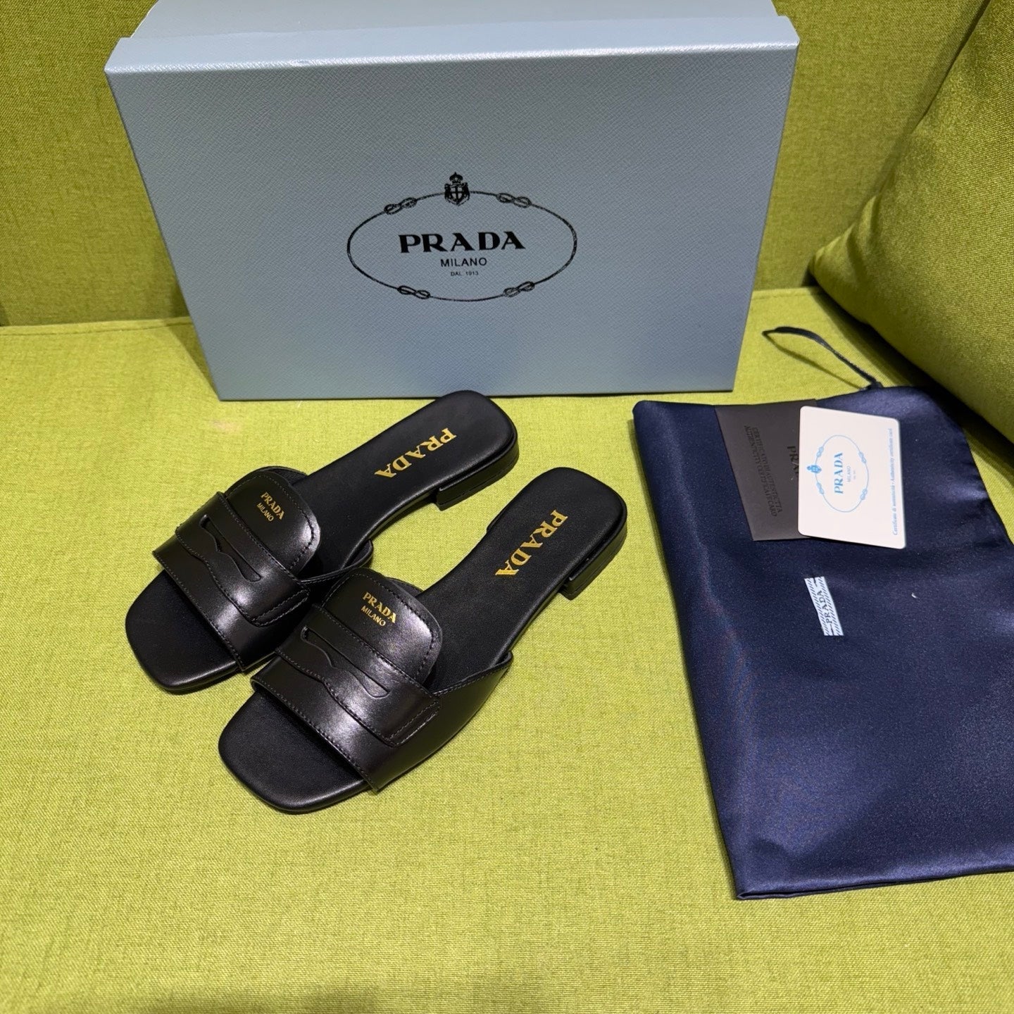 PRADA 25S SLIDES IN BLACK CALFSKIN